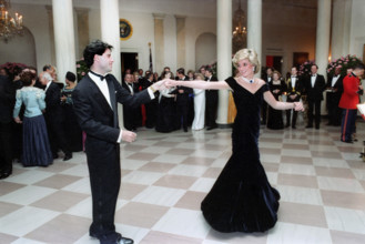 American actor John Travolta dancing with Princess Diana in Cross Hall of the White House,