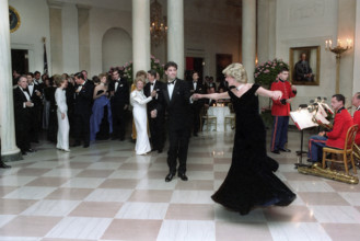 American actor John Travolta dancing with Princess Diana in Cross Hall of the White House,