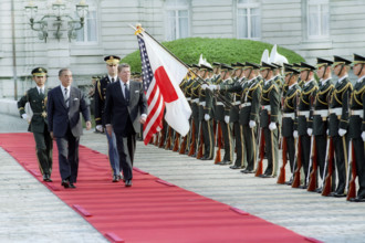 U.S. President Ronald Reagan reviewing troops with Japanese Prime Minister Yasuhiro Nakasone at