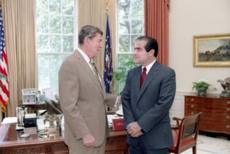 U.S. President Ronald Reagan meeting with Judge Antonin Scalia, Reagan's nominee for Associate