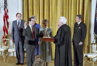 U.S. President Ronald Reagan watching swearing-In ceremony for Associate Justice Antonin Scalia by