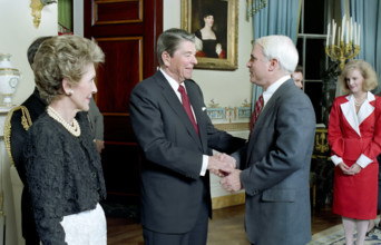 U.S. President Ronald Reagan and U.S. First Lady Nancy Reagan greeting John McCain in the White