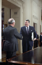 U.S. President Ronald Reagan and Soviet General Secretary Mikhail Gorbachev shaking hands after