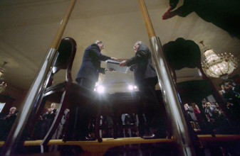 U.S. President Ronald Reagan and Soviet General Secretary Mikhail Gorbachev holding signed INF