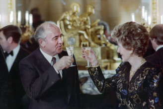 Soviet General Secretary Mikhail Gorbachev and U.S. First Lady Nancy Reagan toasting champagne at