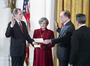 U.S. President Ronald Reagan watching swearing-in ceremony for Judge Anthony Kennedy as associate