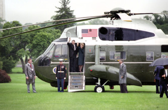 U.S. President Ronald Reagan and U.S. First Lady Nancy Reagan waving from Marine One as they depart