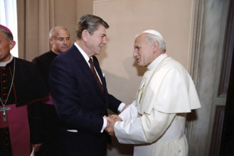 U.S. President Ronald Reagan meeting with Pope John Paul II during visit to papal library,