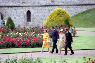 U.S. President Ronald Reagan (2nd left)  and U.S. First Lady Nancy Reagan (2nd right) walking with