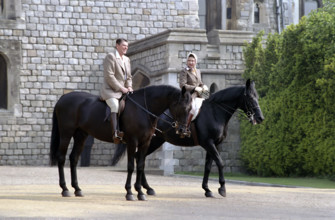 U.S. President Ronald Reagan riding horses with Queen Elizabeth II during visit to Windsor Castle,
