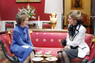 U.S. First Lady Nancy Reagan having tea with Queen Noor of Jordan in the White House Red Room,