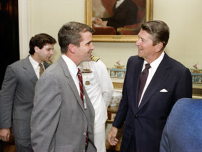 U.S. President Ronald Reagan greeting Oliver North during ceremony to present Medal of Freedom to