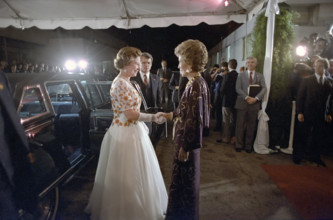 Arrival of Queen Elizabeth II and greeted by U.S. First Lady Nancy Reagan at reception and dinner,