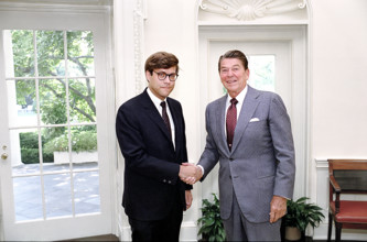 U.S. President Ronald Reagan and Deputy Assistant Director for Legal Policy William Barr shaking
