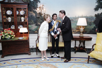 U.S. President Ronald Reagan talking to Nancy Reagan and Michael Jackson at ceremony to present