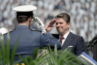 U.S. President Ronald Reagan saluting Air Force cadet at United States Air Force Academy