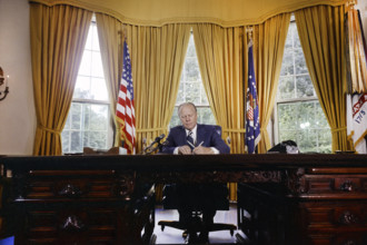 U.S. President Gerald R. Ford signing proclamation granting pardon to former U.S. President Richard