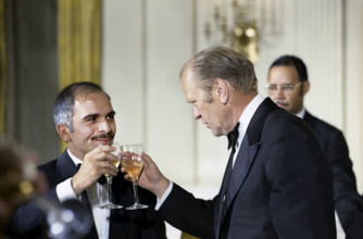 U.S. President Gerald R. Ford and King Hussein of Jordan raising their glasses at stag dinner held