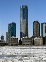 View of Jersey City, New Jersey, USA skyline with 99 Hudson Street (center) across frozen Hudson