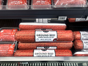 Tubes of ground beef in grocery store
