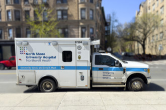 North Shore University Hospital Northwell Health EMS ambulance parked on urban street, Chelsea,