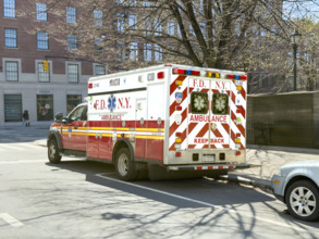 New York City Fire Department EMS ambulance parked on urban street, Chelsea, Manhattan, New York