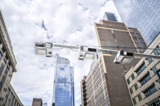 Low angle view of congestion pricing scanners with cityscape in background, Hudson Yards, New York