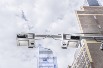Low angle view of congestion pricing scanners with cityscape in background, Hudson Yards, New York