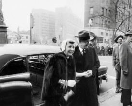 U.S. President-elect Dwight D. Eisenhower and his wife Mamie Eisenhower exiting car to attend