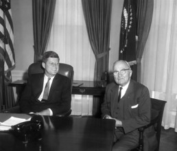 U.S. President John F. Kennedy (left) talking with former U.S. President Harry S. Truman (right) in