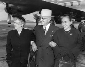U.S. President Harry S. Truman (center) standing with U.S. First Lady Bess W. Truman (left) and