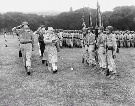 Four Nisei soldiers present the colors as U.S. President Harry S. Truman reviews 442nd Regimental