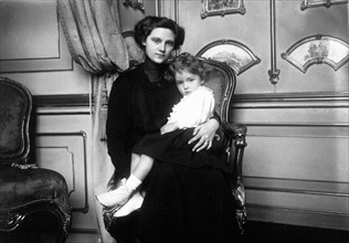 Empress Zita of Austria holding a child