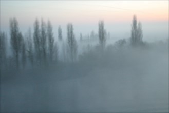 France, valley of the seine around duclair in the fog (as seen from a cargo ship)