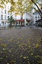France, ile de france, paris 4e arrondissement, le marais, place du marche sainte catherine, automne, feuilles.
Date : 2011-2012