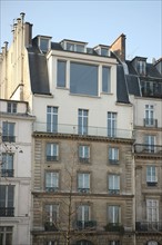 France, ile de france, paris 5e arrondissement, 21 quai malaquais, haut inattendu d'un immeuble, surelevation, atelier d'artiste, elevation.
Date : 2011-2012