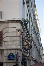 Sign "Au Port Salut" in Paris