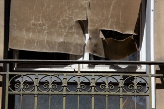 Torn curtain in a window, Lyon