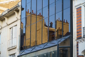 Reims, reflection in a building facade