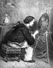 Un peintre dans son atelier.
