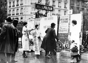 Women pasting posters in Paris, 1930s