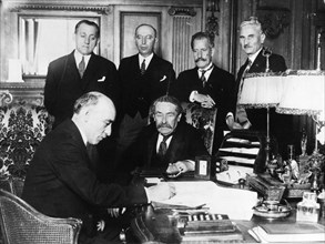 About 1928. France and Yugoslavia.sign a Treaty of Friendship.