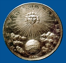 Médaille d'argent :  le soleil dominant le monde