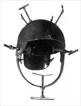 Helmet with screws used for torturing resistance fighters