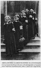 German ambulance women wearing their gas masks.