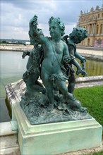 Statue in the gardens of Versailles castle