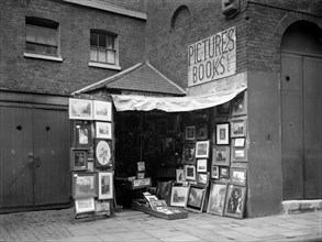 Framed pictures displayed outside a second hand book and picture shop, London, 1933