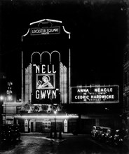 Night view of the Leicester Square theatre, London, c1930