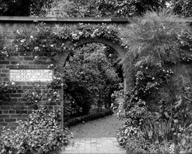 Entrance to the herb garden in Wardrobe Court, Hampton Court Palace, Richmond, London