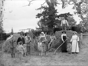 Convalescent soldiers helping women and children with haymaking, Great Dixter, East Sussex, 1916